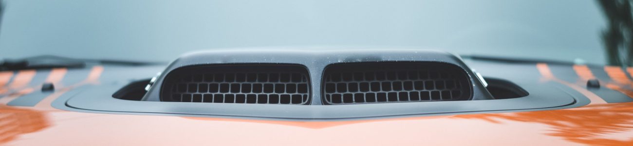 black-intake-on-orange-sports-car black-intake-on-orange-sports-car